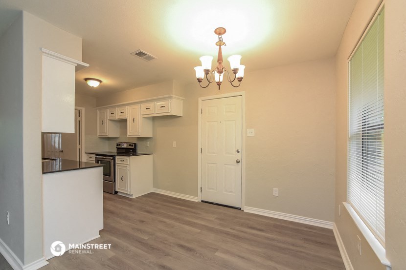 the kitchen and living room of a 560 sq ft home