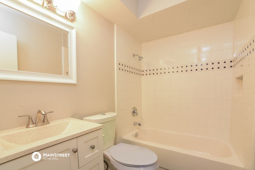 a bathroom with a sink toilet and a bath tub