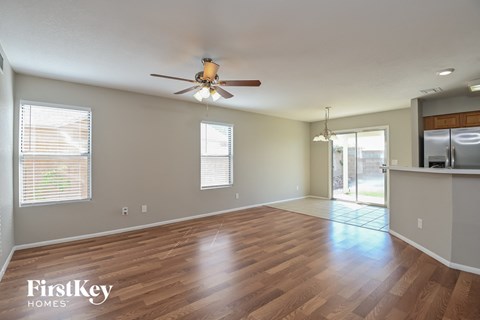 the living room and dining room are open to the kitchen
