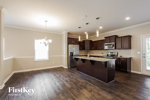 a kitchen with a large island in the middle of it