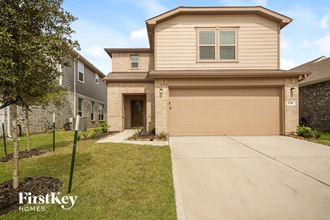 a house with a driveway and a garage door