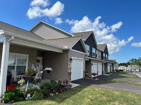 A row of houses with a clear blue sky above them.