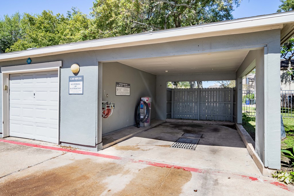 the entrance to a parking garage with a white garage door