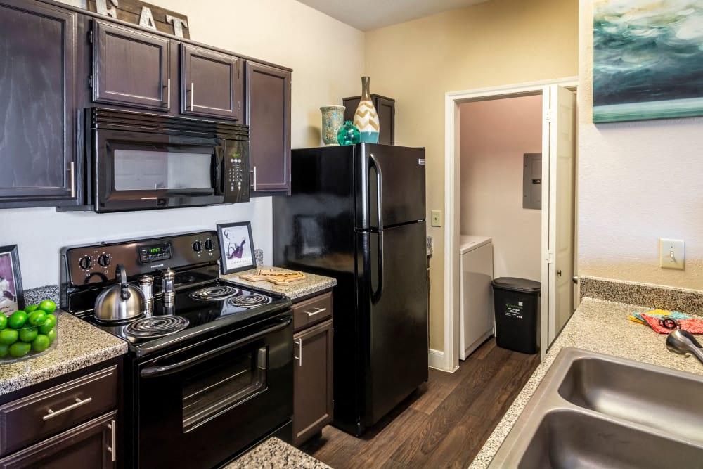 a kitchen with a stove microwave and refrigerator