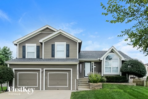 a house with a garage and a lawn