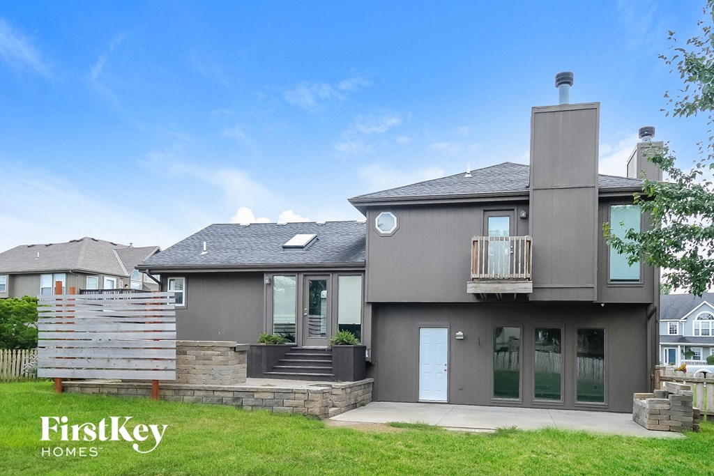 a with a yard and a blue sky