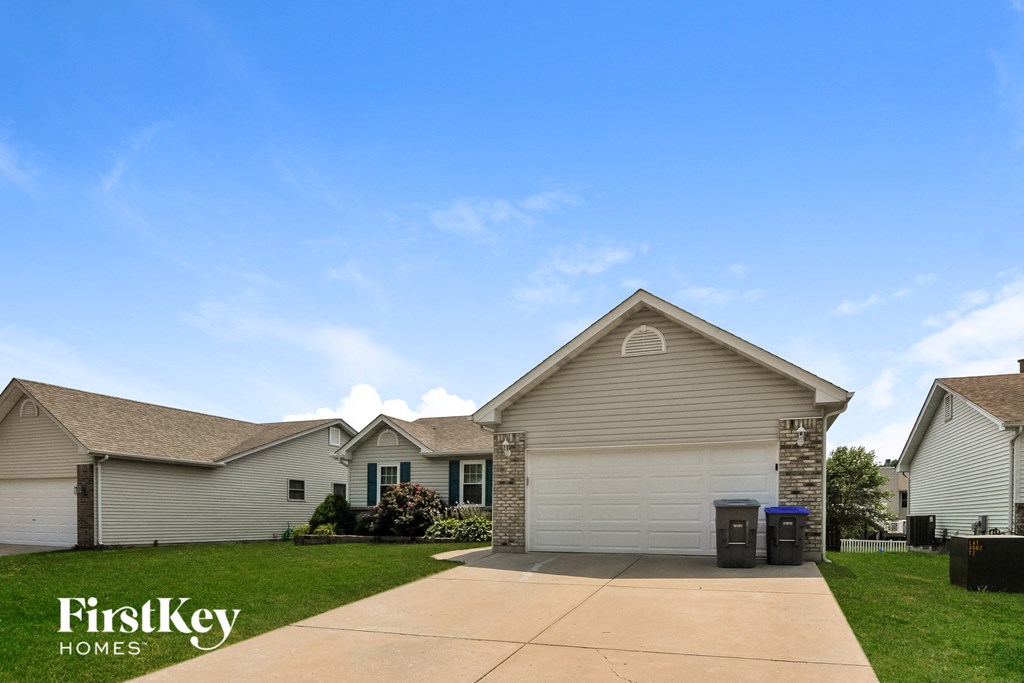 a beige house with a blue sky in the background
