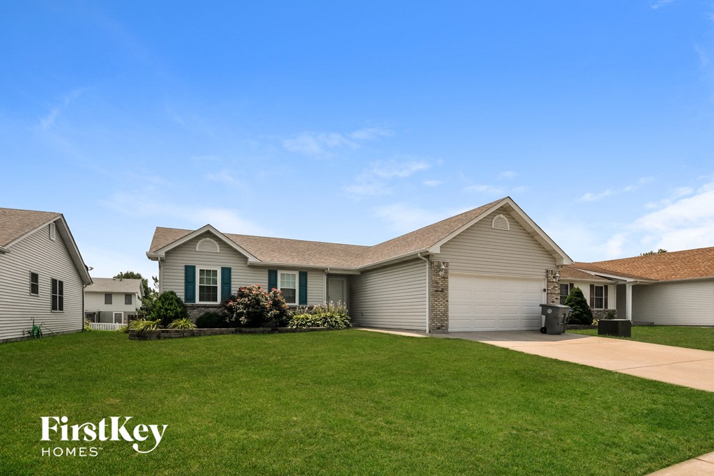 a house with a lawn in front of it