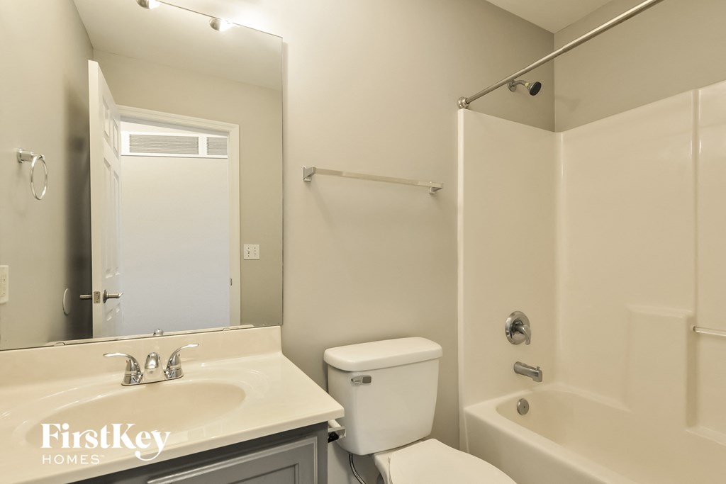 a bathroom with a sink toilet and a shower