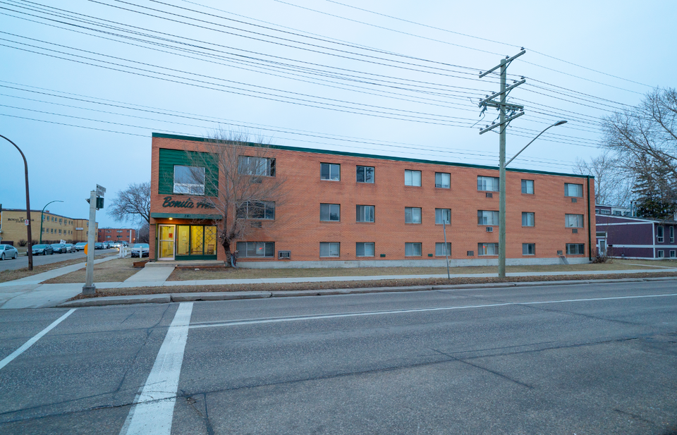 a red brick building on the corner of a street