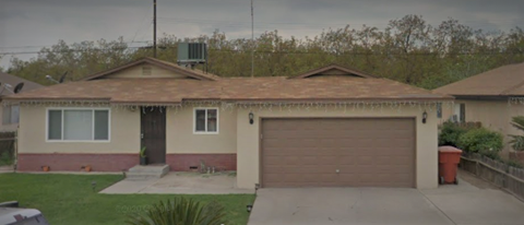 a house with a brown roof and a brown garage door