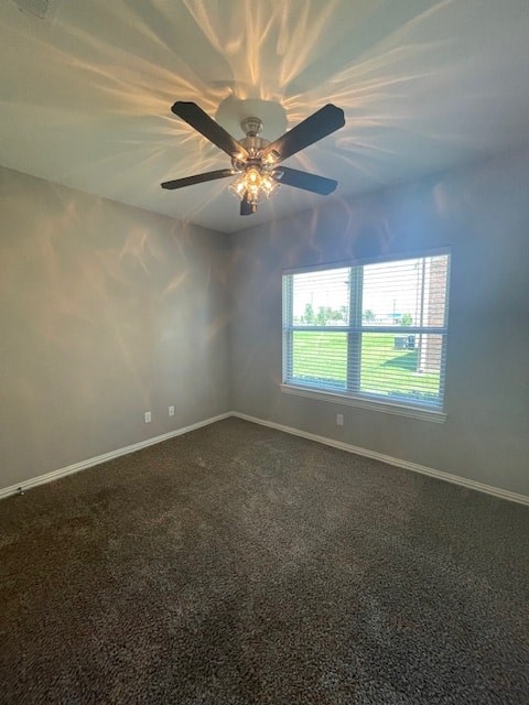 A room with a ceiling fan and a window.