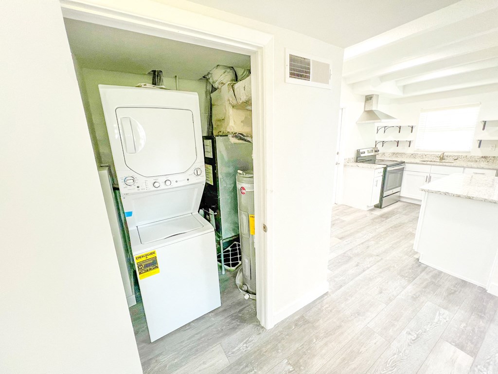 a small laundry room with a washer and dryer in it