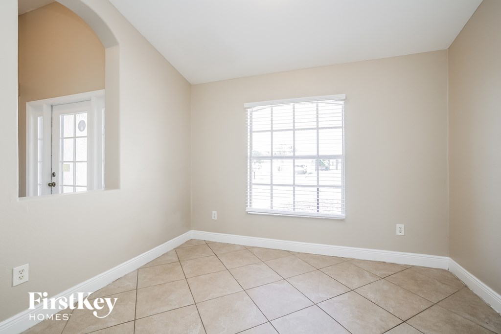 A room with a window and a door.
