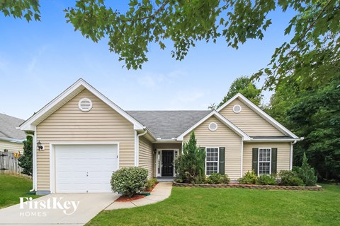 a beige house with a white garage door