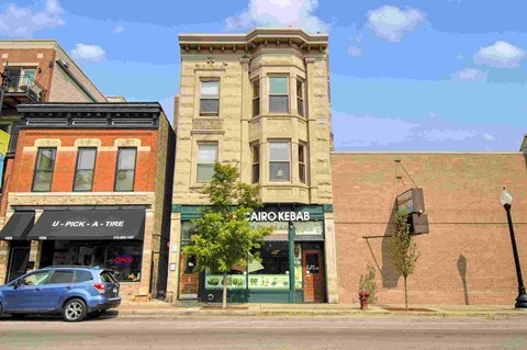 a car parked in front of a building on a city street
