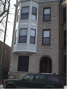 a building with a car parked in front of it