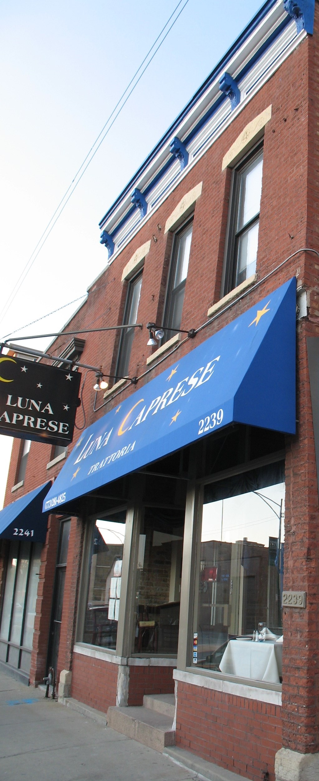 a blue awning on the side of a building