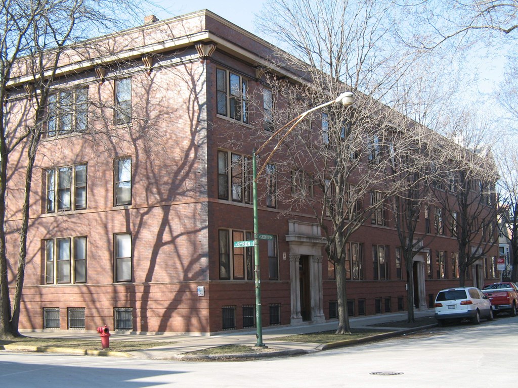 a red brick building on the corner of a street