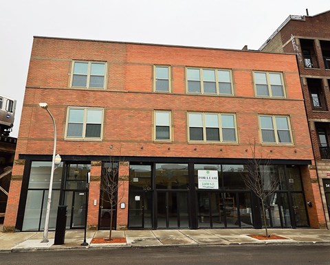 a red brick building on the corner of a street