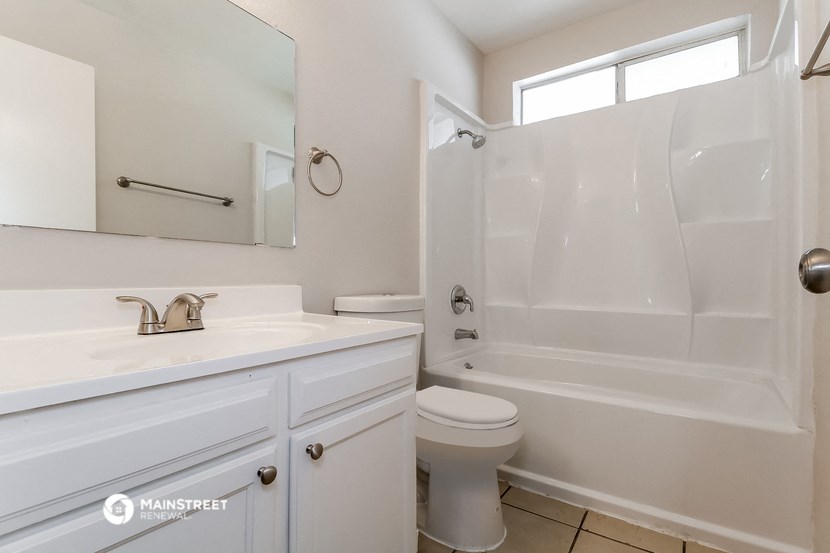 a bathroom with a sink toilet and a shower