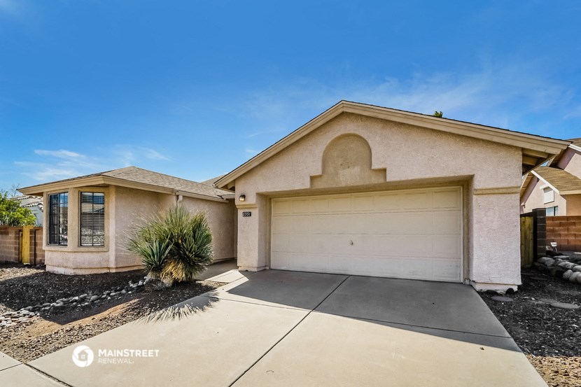 a house with a white garage door and a driveway