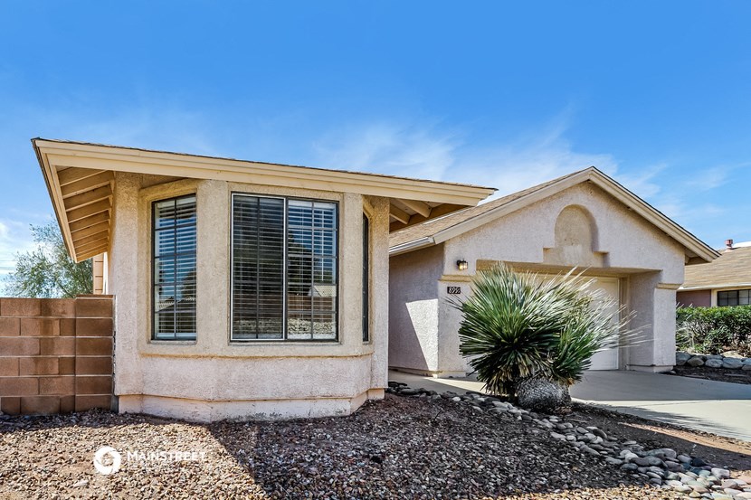 a house with a palm tree in front of it