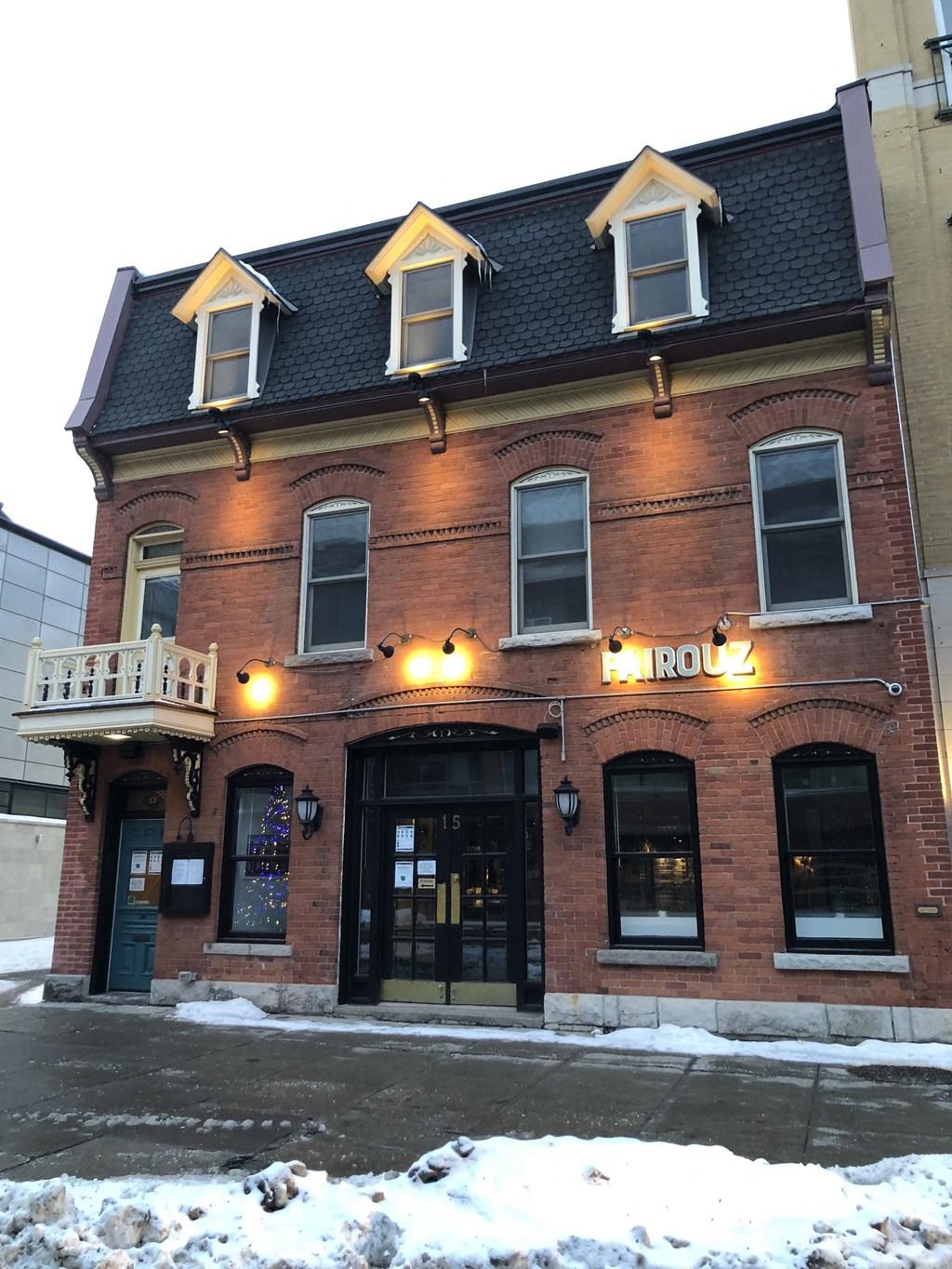 the front of the roo building in the snow