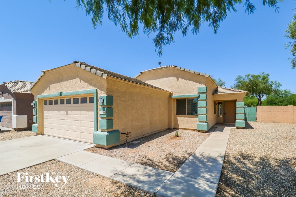 A house with a brown and teal exterior is for sale.