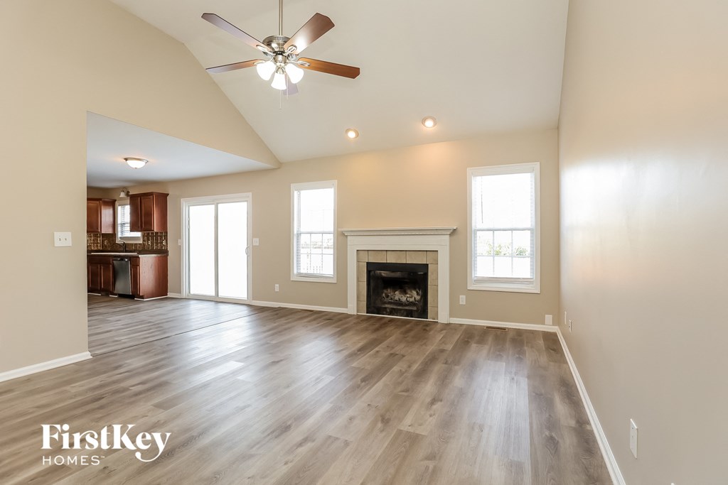 the living room is open to the kitchen and family room