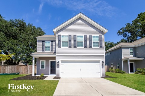 A two-story house with a garage is for sale by FirstKey Homes.