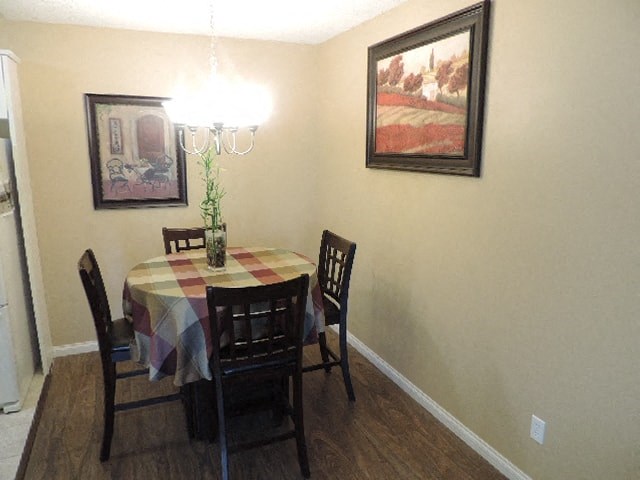 a dining room with a table and chairs