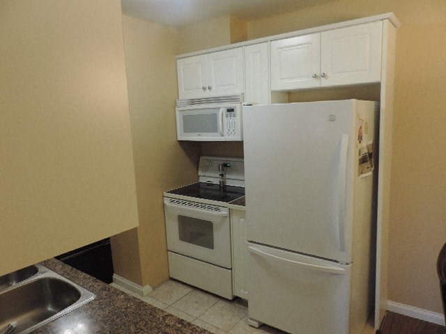 a kitchen with a refrigerator microwave and stove