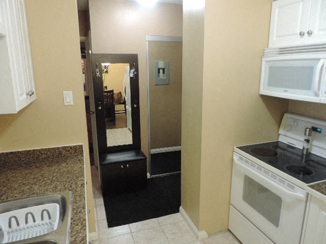 a kitchen with a stove and a microwave