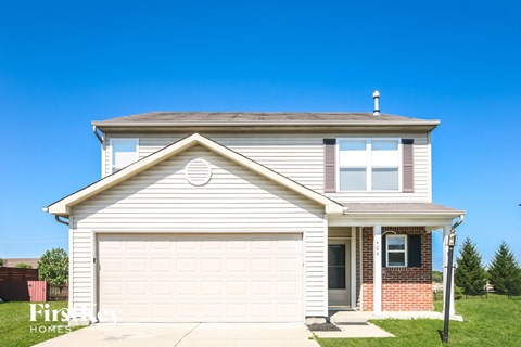 a white house with a white garage door