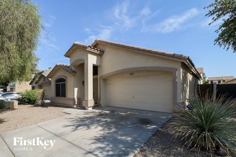 a house with a white garage door and a driveway
