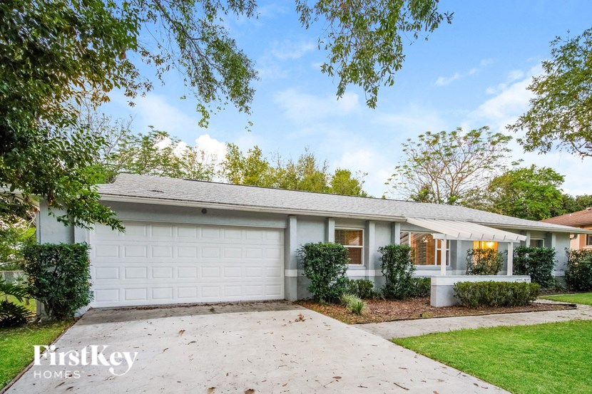 A house with a garage is for sale.