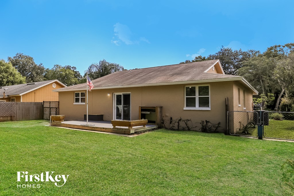 a house with a lawn and a flag on the porch