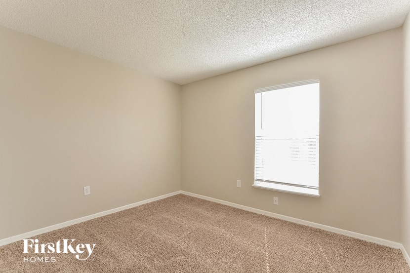 the living room of a house with a window