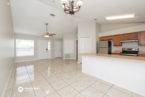 an open kitchen with a large counter top and a large
