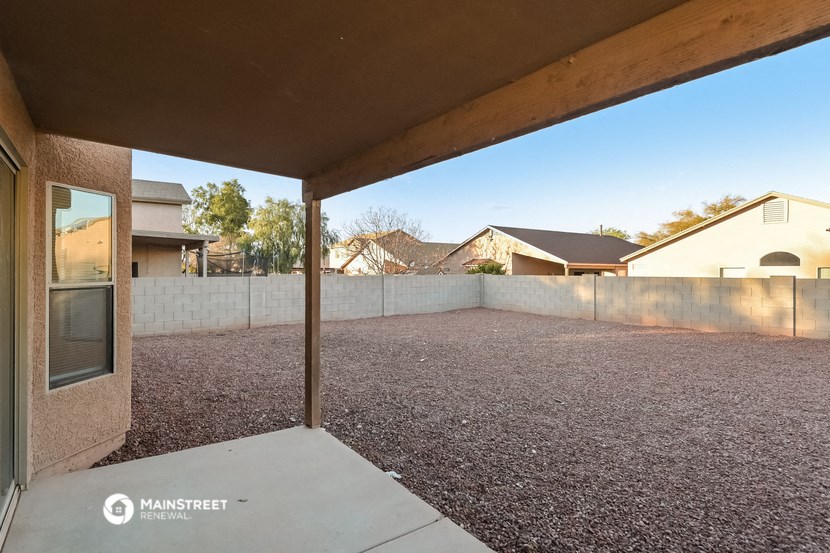 a view of the backyard from the patio of a house
