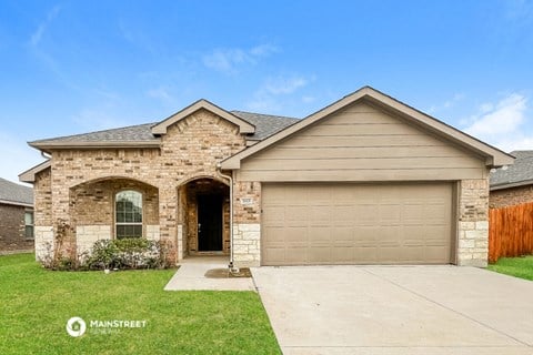 a brick house with a garage door