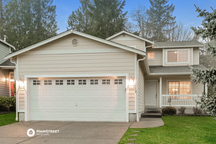 a white house with a white garage door