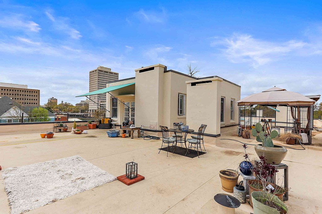 the building has a roof terrace with tables and chairs