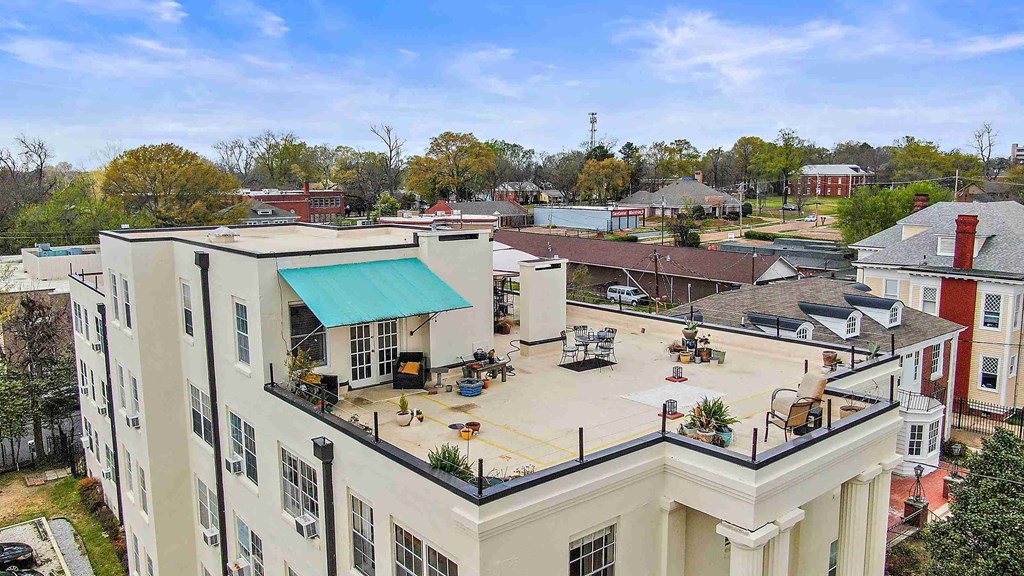 an aerial view of the courtyard of a building in a city