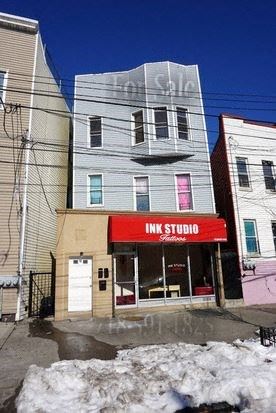a building with a red sign on the front of it