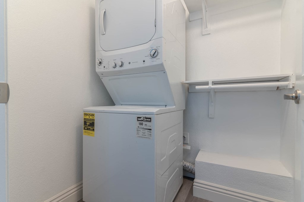 the laundry room has a washer and dryer and a sink