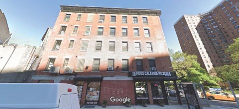 A street view of a building with a Google store on the ground floor.