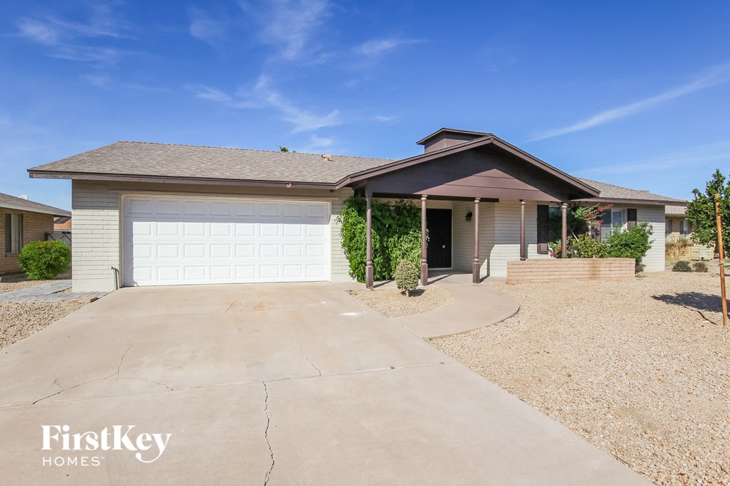 A house with a garage is for sale by FirstKey Homes.