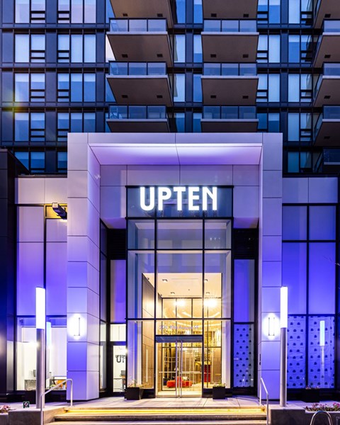 night view of the entrance to the uptown office building